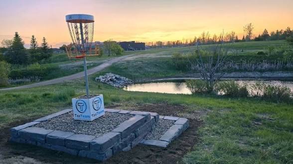 Sunningdale Park disc golf course and pond at sunset, Moose Jaw